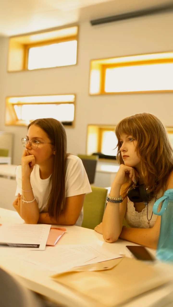 Students listening in a session at Apex XY Camp