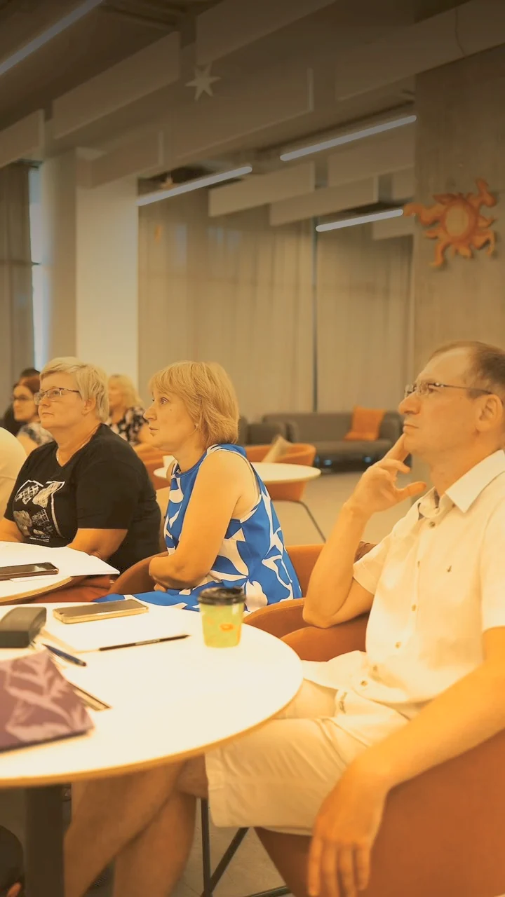 Teachers at a round table during a summer school session